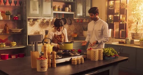 Young Adults Cooking Together in Kitchen