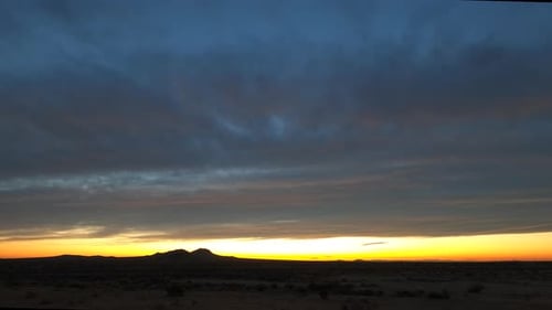Dramatic sunrise time lapse landscape over Mojave Desert in California