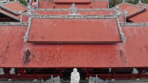 Aerial View of Ornate Temple with Red Tile Roof