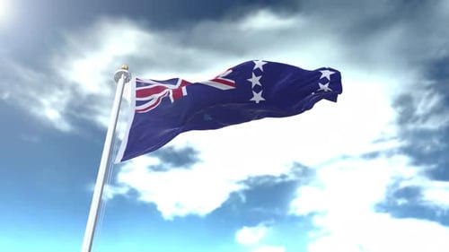 Cook Islands Flag Waving Against a Cloudy Blue Sky