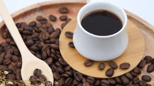 Coffee Cup and Beans with Wooden Spoon