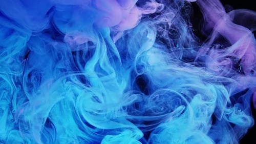 Abstract Blue and Purple Ink Swirling Underwater