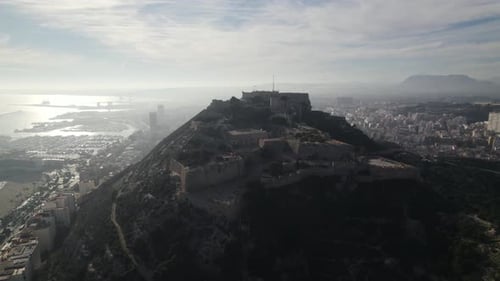 Medieval hilltop Santa Bárbara Castle, Alicante, Spain, against sprawling Alicante cityscape