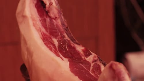 Cured Hams Hanging in a Traditional Smokehouse Convey a Rich Gastronomic Heritage