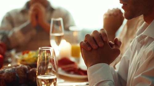 Family Meal with Clasped Hands Praying