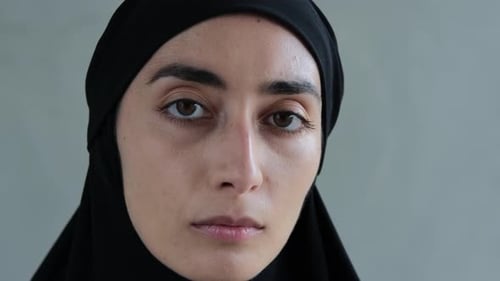 Closeup of the Beautiful Face of an Arab Woman in a Black Hijab