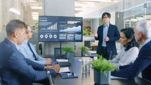 Business Presentation in Modern Boardroom with Colleagues