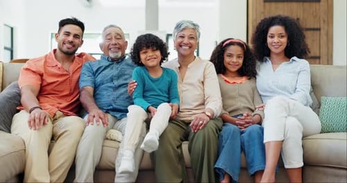 Smiling Family Portrait on Couch in Home
