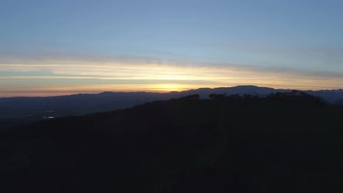 Lush Green Landscape At Sunset By Aerial Drone