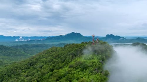 4K Hyperlapse of Mountain Peaks Covered in Fog with Signal Station Above