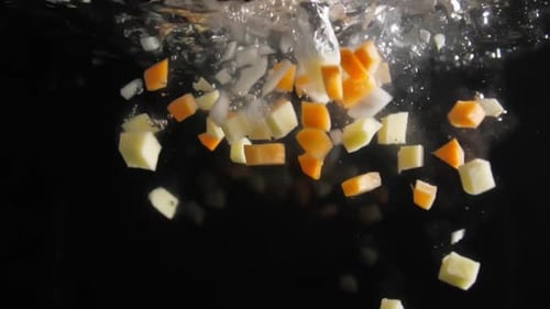 Chopped Vegetables Falling Into Water