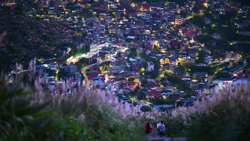 Overlooking the lively and colorful valley villages at night. Jiufen, Taiwan.