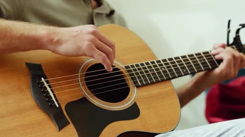 Close Up of Man Playing Guitar Adult