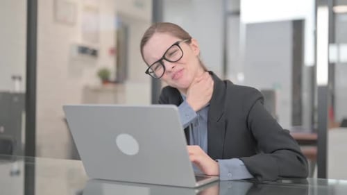Businesswoman with Neck Pain in Office