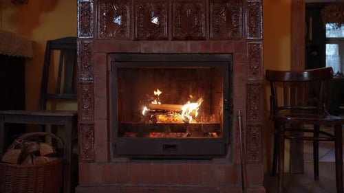 Cozy Fireplace with Burning Logs and Brick Surround