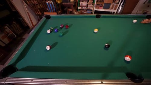 Sinking the solid blue ball from a high angle.