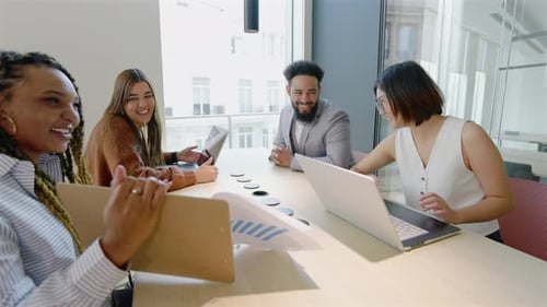 A Group of Diverse Professionals Engaging Effectively in a Modern Office Meeting Setting