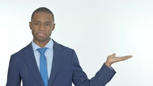 African Businessman Showing on Side on White Background
