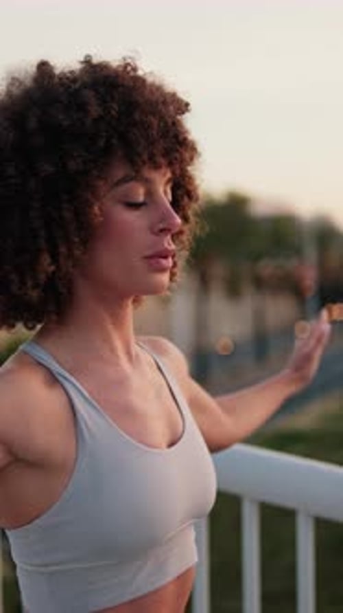 Vertical video, Woman Doing Fitness Exercises on a Bridge
