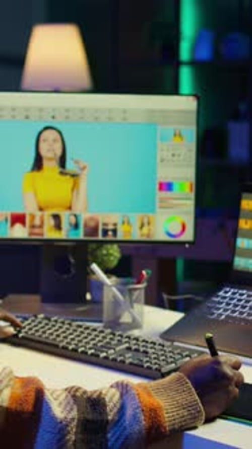 Vertical Video African American Photo Designer Retouching Images on Dual Monitors