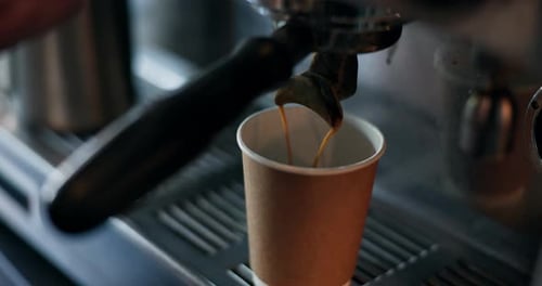 Cafe, coffee machine and pouring espresso for take away with barista, small business or hospitality
