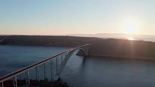 Drone shot of the bridge and ocean in the sunset 2