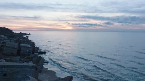 Aerial establishing view of abandoned seaside fortification buildings at Karosta Northern Forts on t