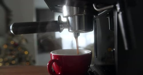 Fresh Espresso Being Poured at Home During Christmas