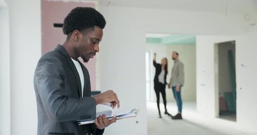 Architectural Enthusiasts African Real Estate Agent Showcases a Unique Avantgarde House to a Couple