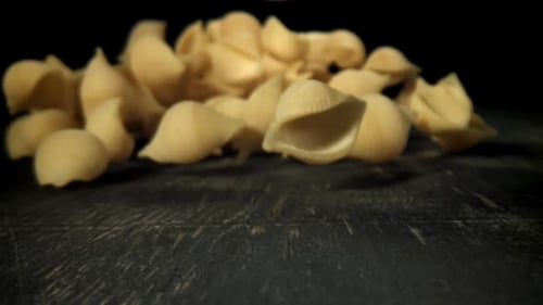 Dry Pasta Falls on the Table Filmed on a Highspeed Camera at 1000 Fps