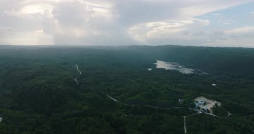 Aerial View of Tropical Mountain Range and River in Rainforest Philippines