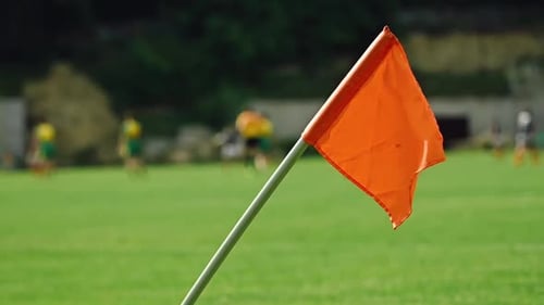 Orange Corner Flag on a Sunny Soccer Field