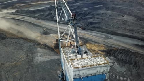 Aerial View of Heavy Mining Equipment Performing Operations in the Mining Sector Today Stock Clip
