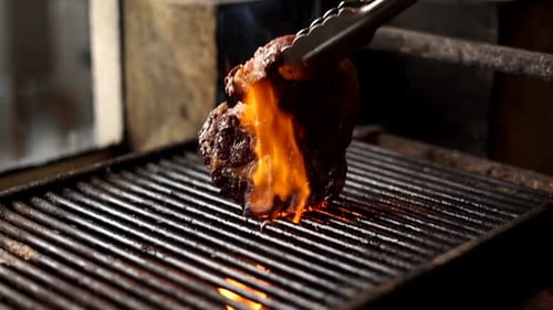Juicy Steak Grilling Over Open Flame