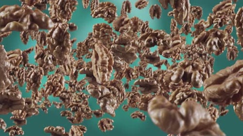 Dynamic Floating Walnuts on Teal Background