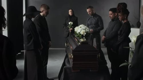 Mourners Standing Around Dark Coffin at Memorial Service