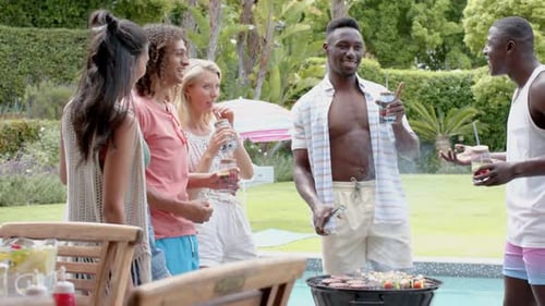 Diverse Friends Enjoying Backyard Barbeque by the Pool