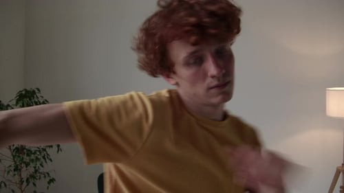 Active and Carefree Man Dancing to Music at Home