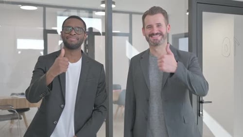 Portrait of Teammates in Office with Thumbs Up