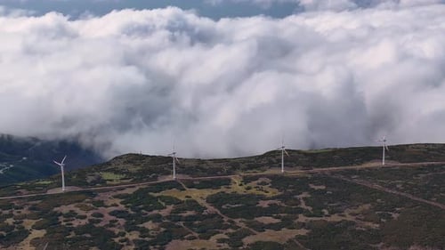 Wind Turbines on Mountain Top with Clouds