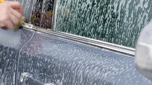 Car Getting Washed with Brush and Soapy Foam