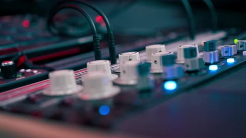 Close Up the Recording Room is Dark with Neon Lighting Prorecording Remote Control for Adjusting and