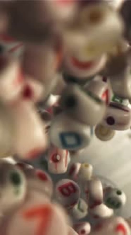 Falling Letters on an Open Textbook Filmed on a Highspeed Camera at 1000 Fps