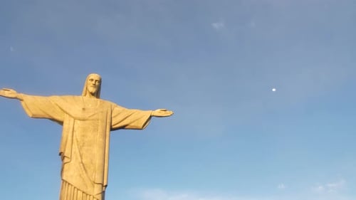 Christ the Redeemer is an Art Deco statue of Jesus in Rio de Janeiro, Brazil drone aerial close up a