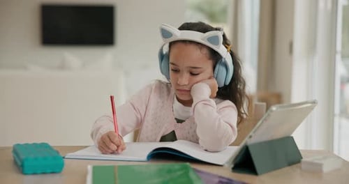 Elearning, tablet and child in house with headphones for homework, project or assignment