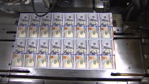 SHEET OF 100 DOLLAR BILLS AT PRINTING PRESS WIDE SHOT