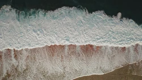 Dramatic Aerial View Of Powerful Ocean Waves Crashing On Shore