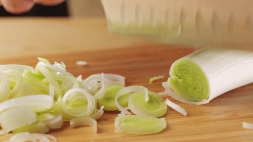 Chef Chopping a Leek White Onion with a Knife on the Cutting Board Macro Close Up of Cutting Red