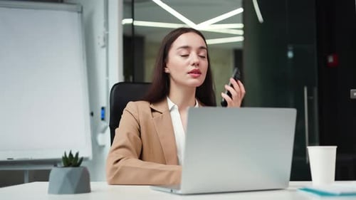 Professional Woman Working and Talking on Cell Phone