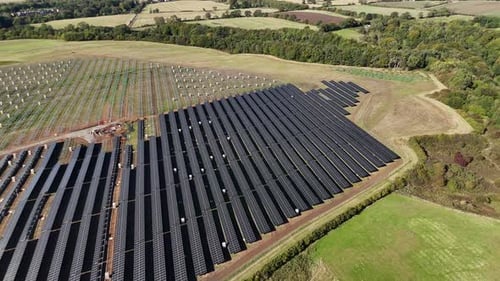 Birds eye view drone aerial Rows of solar farm renewable energy panels photovoltaic green grid